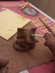 making eye with clay Ganesha 